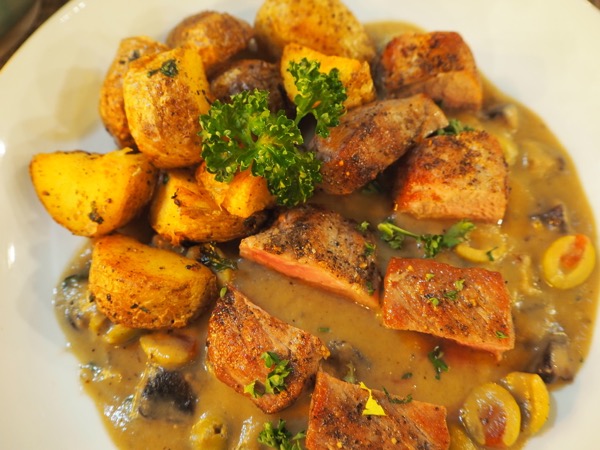Pork dish with olive sauce at Leon de Nimman