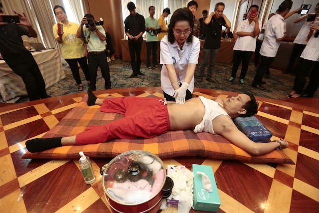 Master Teacher Dr. Saranya Kongjak demonstrating abdominal and karsai massage